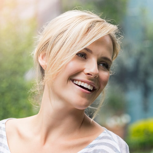 A woman smiling